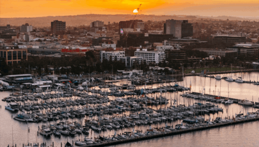 Royal Geelong Yacht Club at sunset with the marina, Clubhouse and Victorian Sailing Centre in view