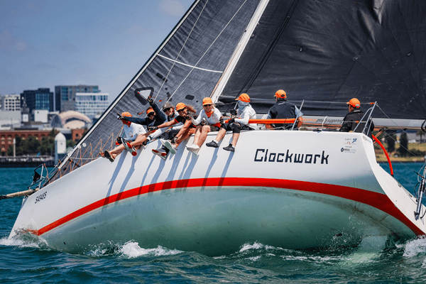 The tea of Clockwork site on the side of the boat as it races at Festival of Sails in 2026. It is the first entry of the Australian Yachting Championship and first interstate entry, being a South Australian boat, for the 2027 regatta.