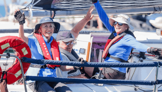 Sailors wave from their boat at the 2026 Festival of Sails. Entries for the 2027 are open now and the Notice of Race has been released.